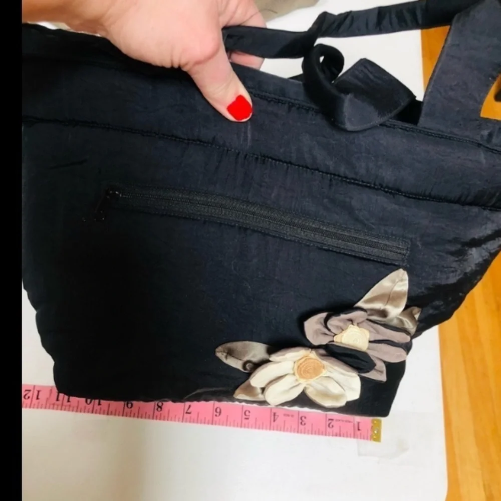 Arisha black super cute microfiber like fabric bag w/ attached flower detail
